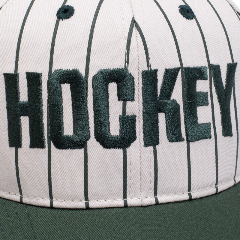 Hockey Snapback Hat Pinstriped Cream front logo close up